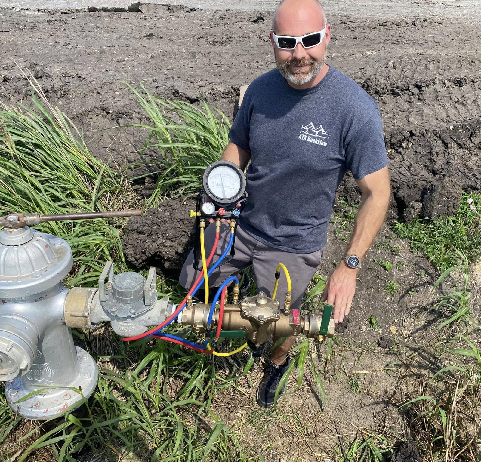 Technician performing residential backflow test