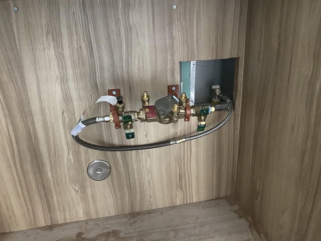 Wall of mounted commercial backflow assemblies